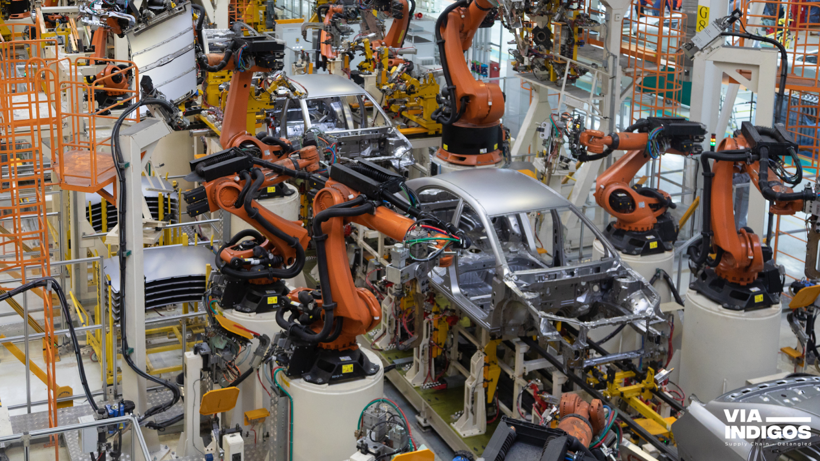 A car body on a conveyor in a modern Automotive assembly line, showcasing advanced automation.