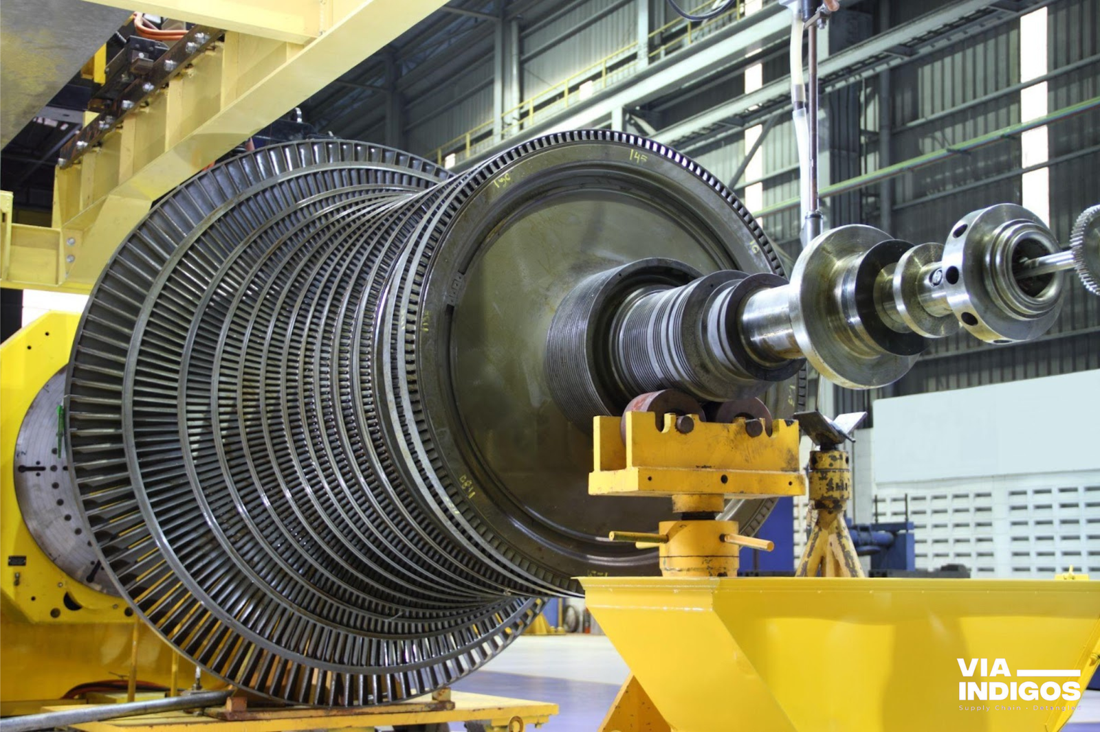 An industrial steam turbine on mammoth lathe under machining.